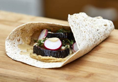 recipe image Harissa Roasted Aubergine with Crispy Kale, Crunchy Radish and Tahini Sauce